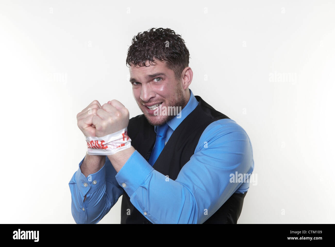 handsome man with his wrist taped up with fragile tape so he cant do any work and in need od some help Stock Photo