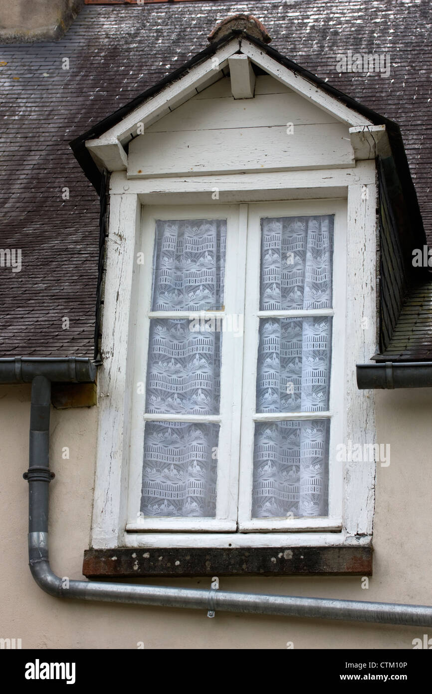 Dormer window and drainpipe Stock Photo