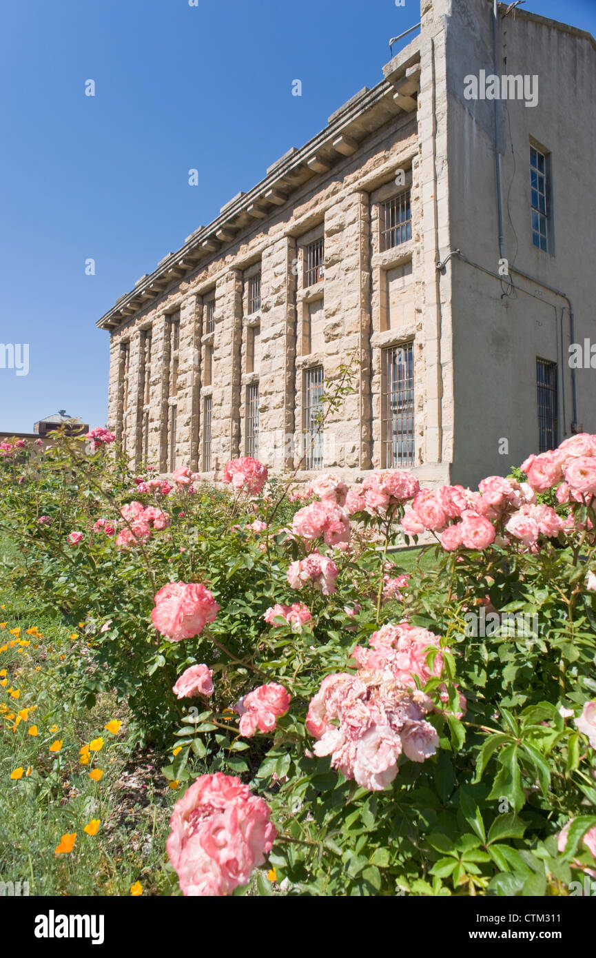 Flowers bloom in front of the old cell block, at the Old Idaho State