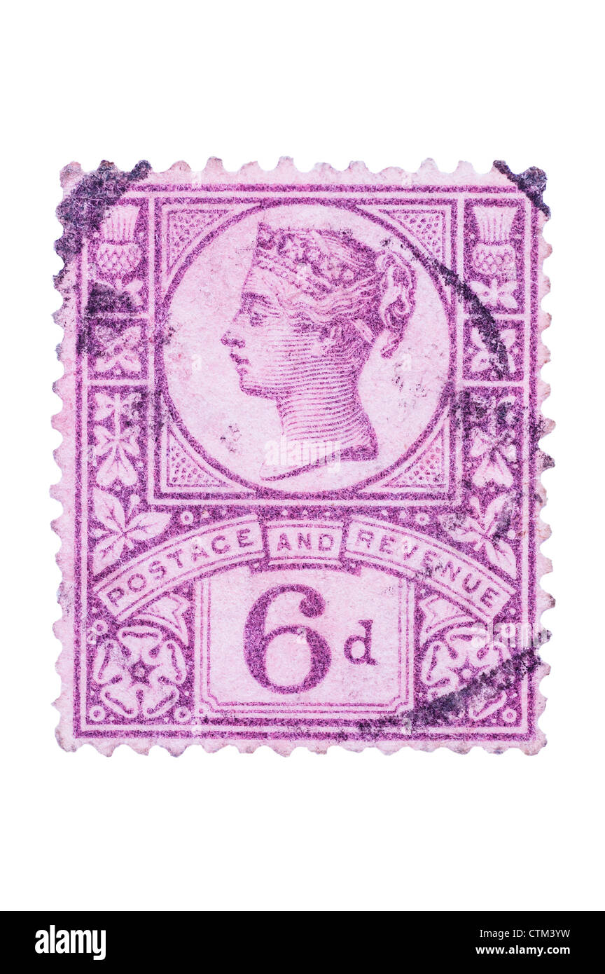 A Victorian six pence purple 6d postage stamp on a white background Stock Photo