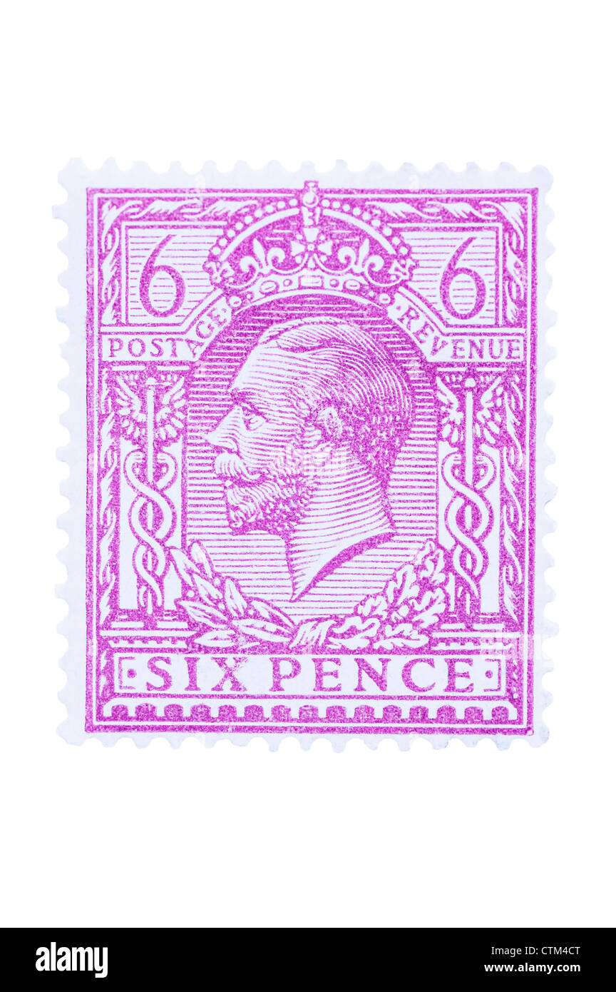 A King V six pence purple 6d postage stamp on a white background