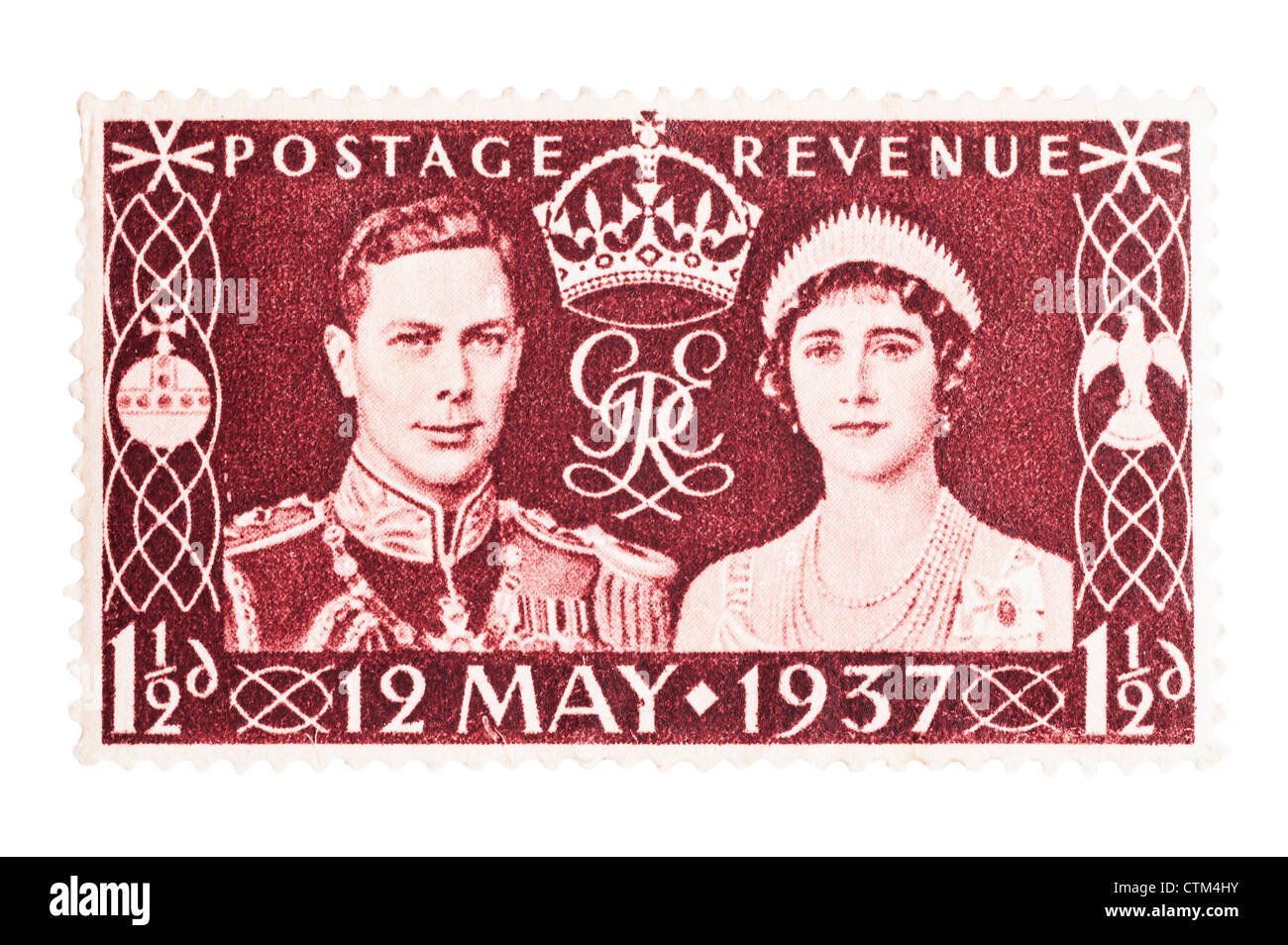 A King George VI one and a half penny red-brown 1 1/2d postage stamp on a white background Stock Photo