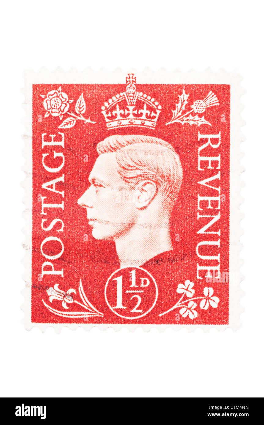 A King George VI one and a half penny red 1 1/2d postage stamp on a white background Stock Photo