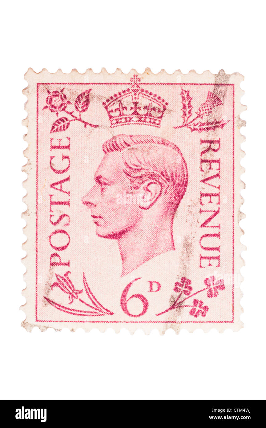 A King VI six pence red 6d postage stamp on a white background