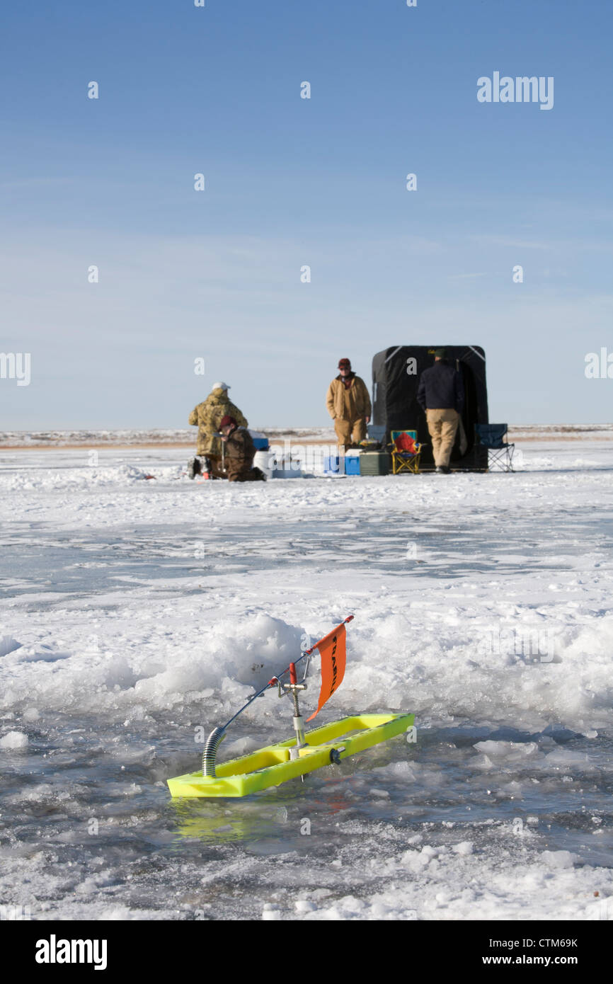 Wisconsin fisherman preparing a tip-up for ice fishing Stock Photo - Alamy