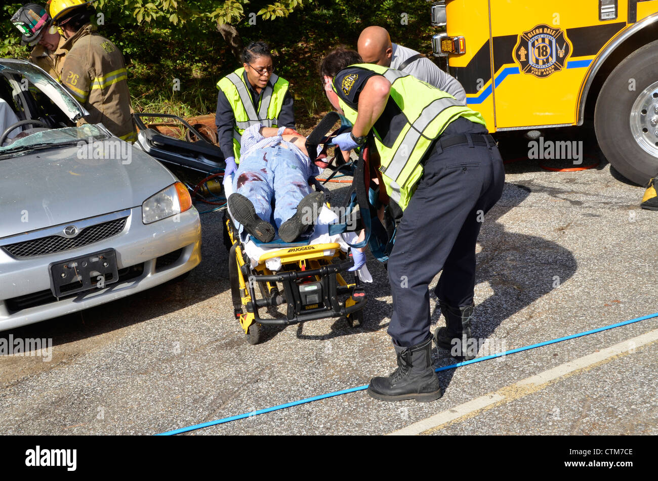 Rescuers rush a badly injured woman to a waiting ambulance in Glendale ...