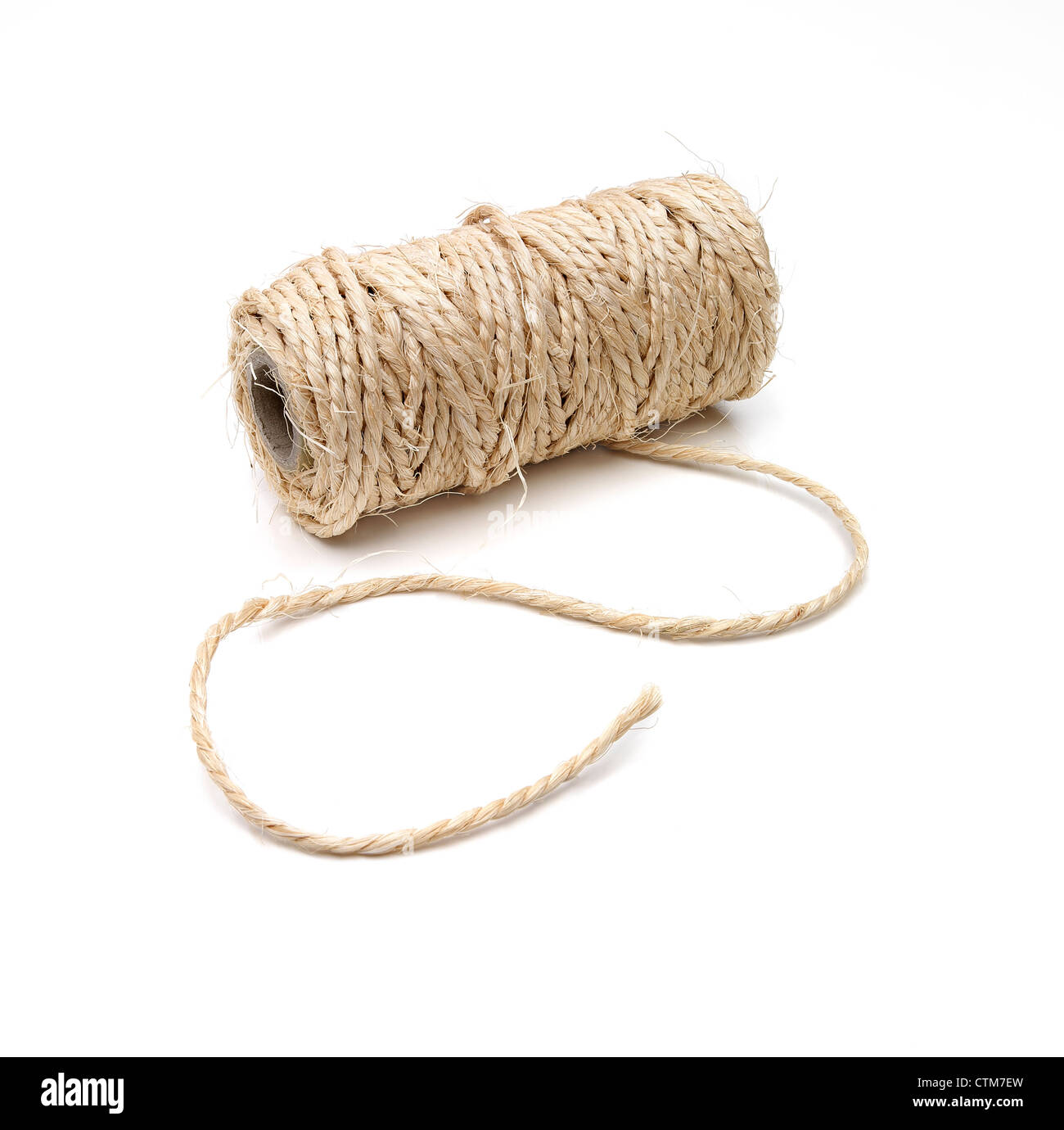 Curved thick string and a roll on white background with a soft