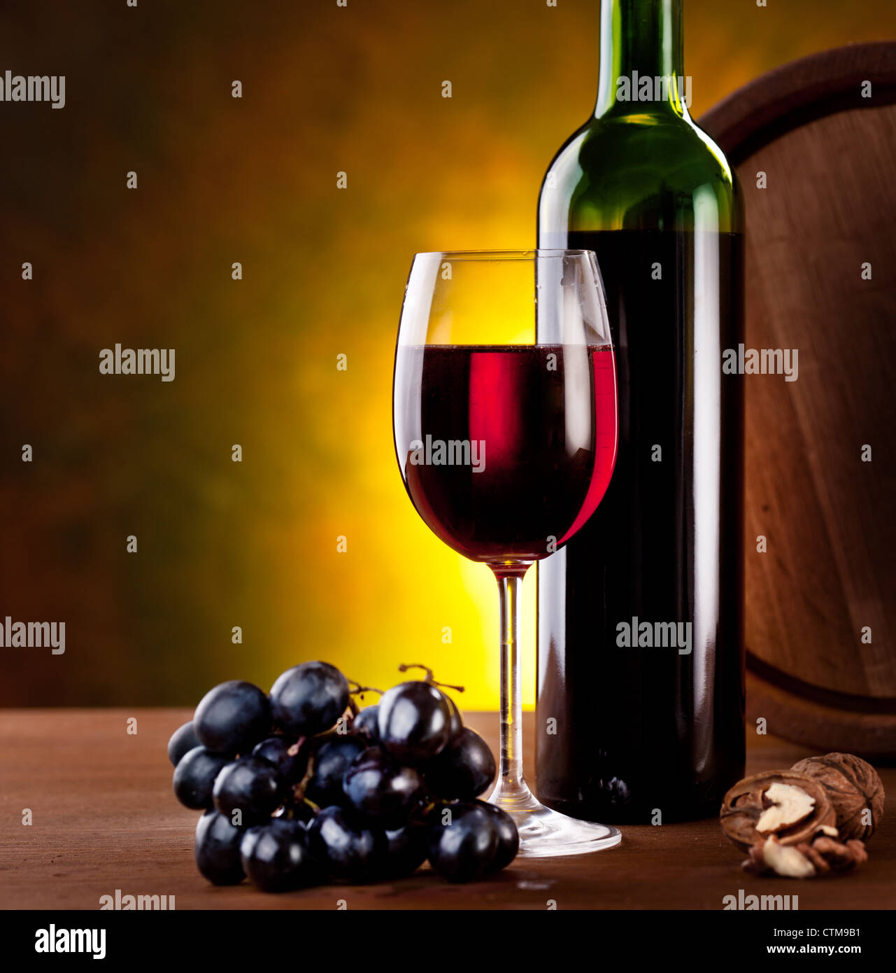 Still life with wine bottle, glass and oak barrels Stock Photo - Alamy