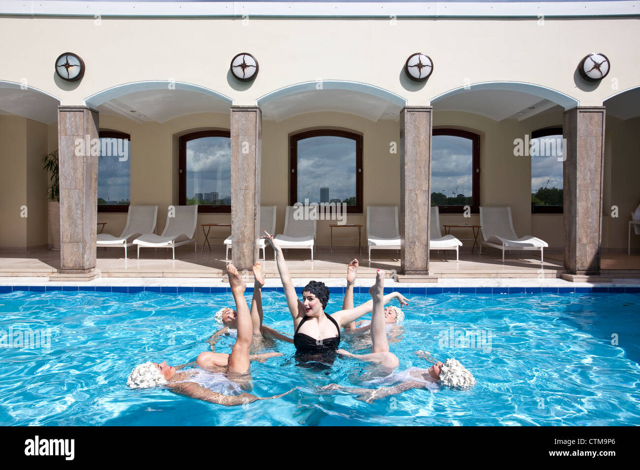 Synchronized swimmers at The Berkeley London rooftop pool, London