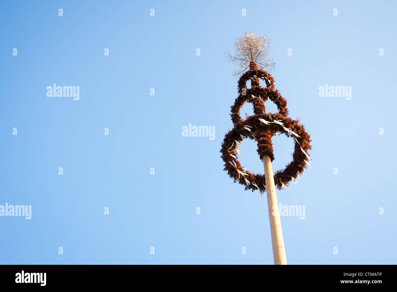 Maypole against blue sky Stock Photo - Alamy