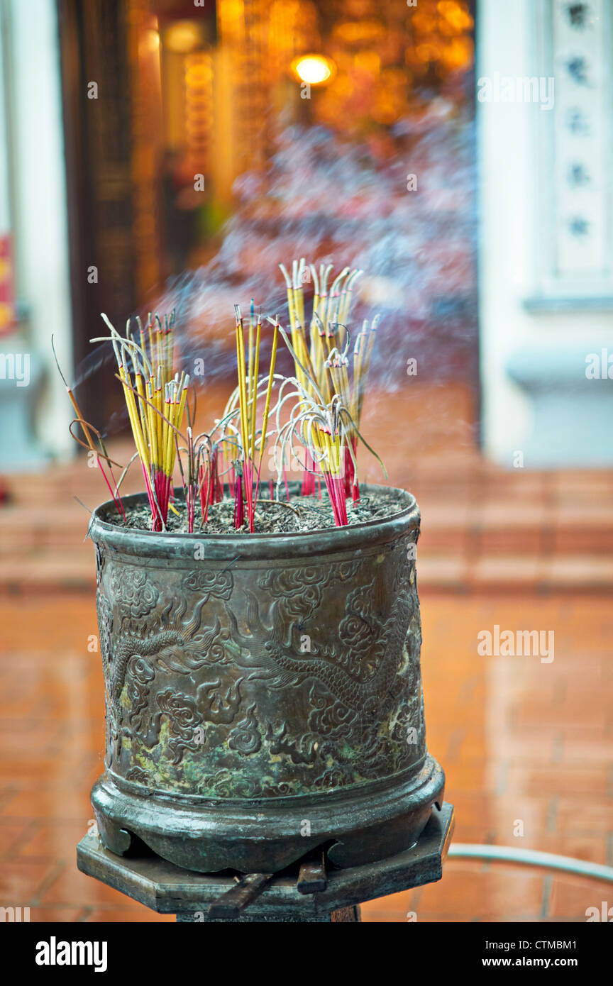 Incense burning at an altar in a temple Stock Photo Alamy