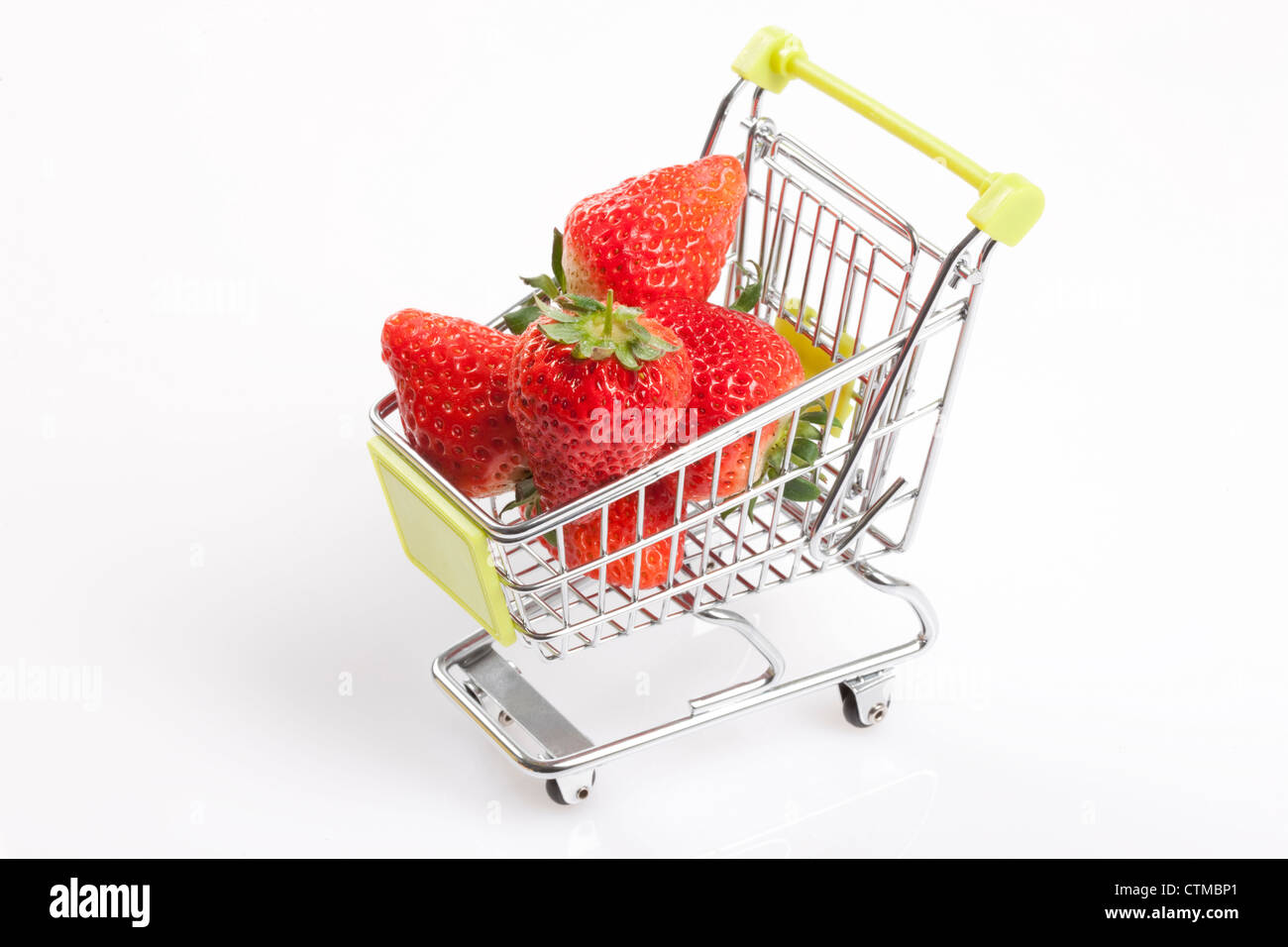 Strawberries in shopping cart Stock Photo