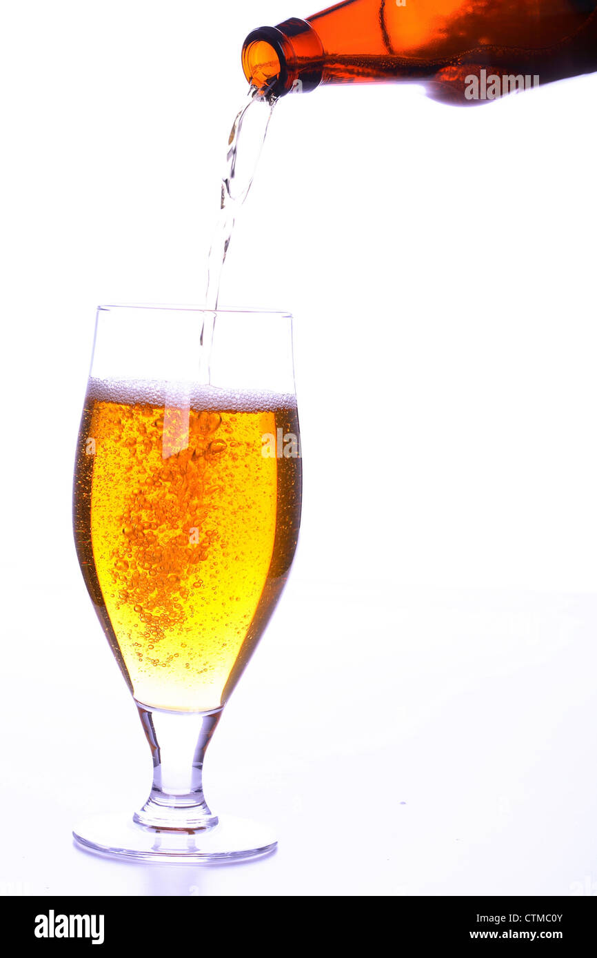 Pouring cold beer into glass Stock Photo Alamy