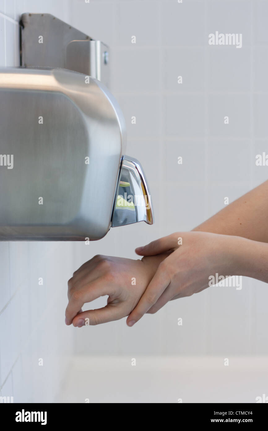 Drying hands in a public restroom (selective focus Stock Photo Alamy