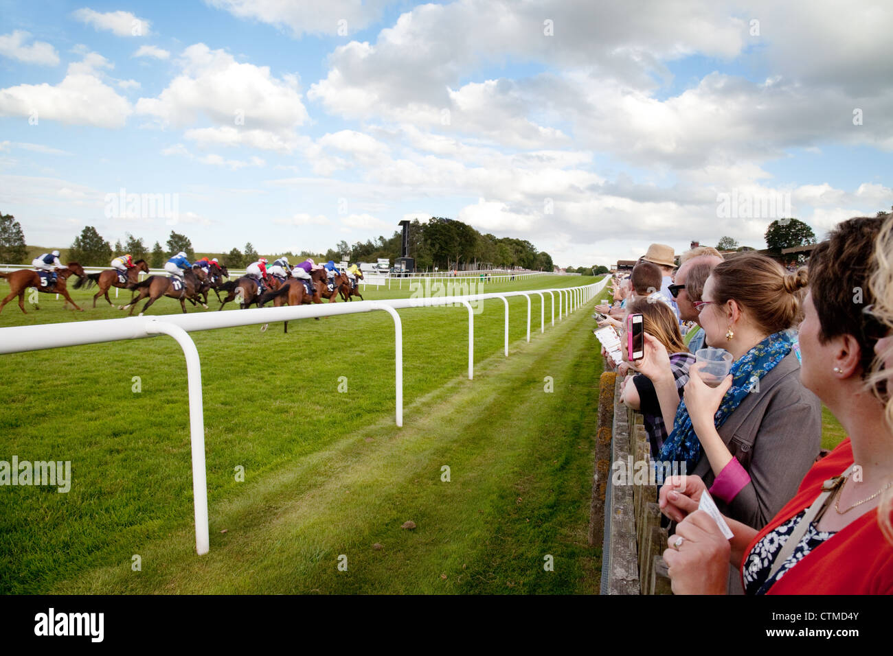 Horse racing UK; People watching the horse racing, Newmarket July Stock