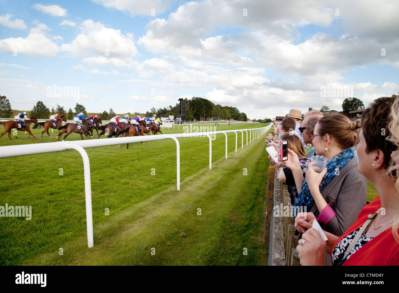 Newmarket Racecourse; Horse racing UK; People watching the horse racing, Newmarket July racecourse, Newmarket Suffolk UK Stock Photo