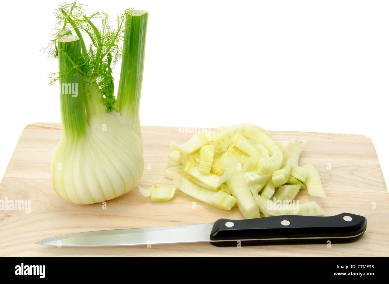 Fennel placed on a wooden cutting board - studio shot with a white background Stock Photo