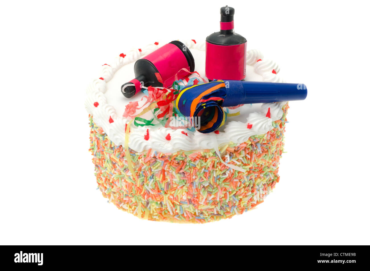 Party cake with party poppers - studio shot with a white background Stock Photo