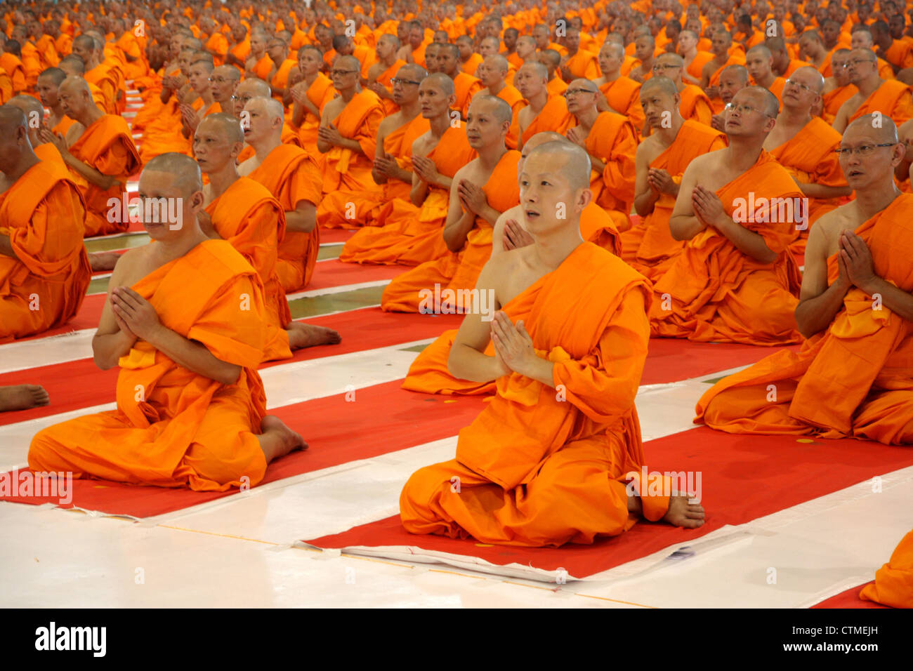 Ten of thousands novice monks during Buddhist lent ceremony , Pathun thani , Thailand Stock Photo
