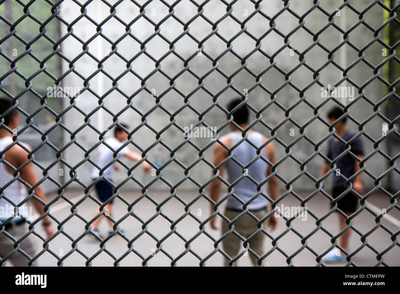 A group of boys play handball in a city facility Stock Photo Alamy