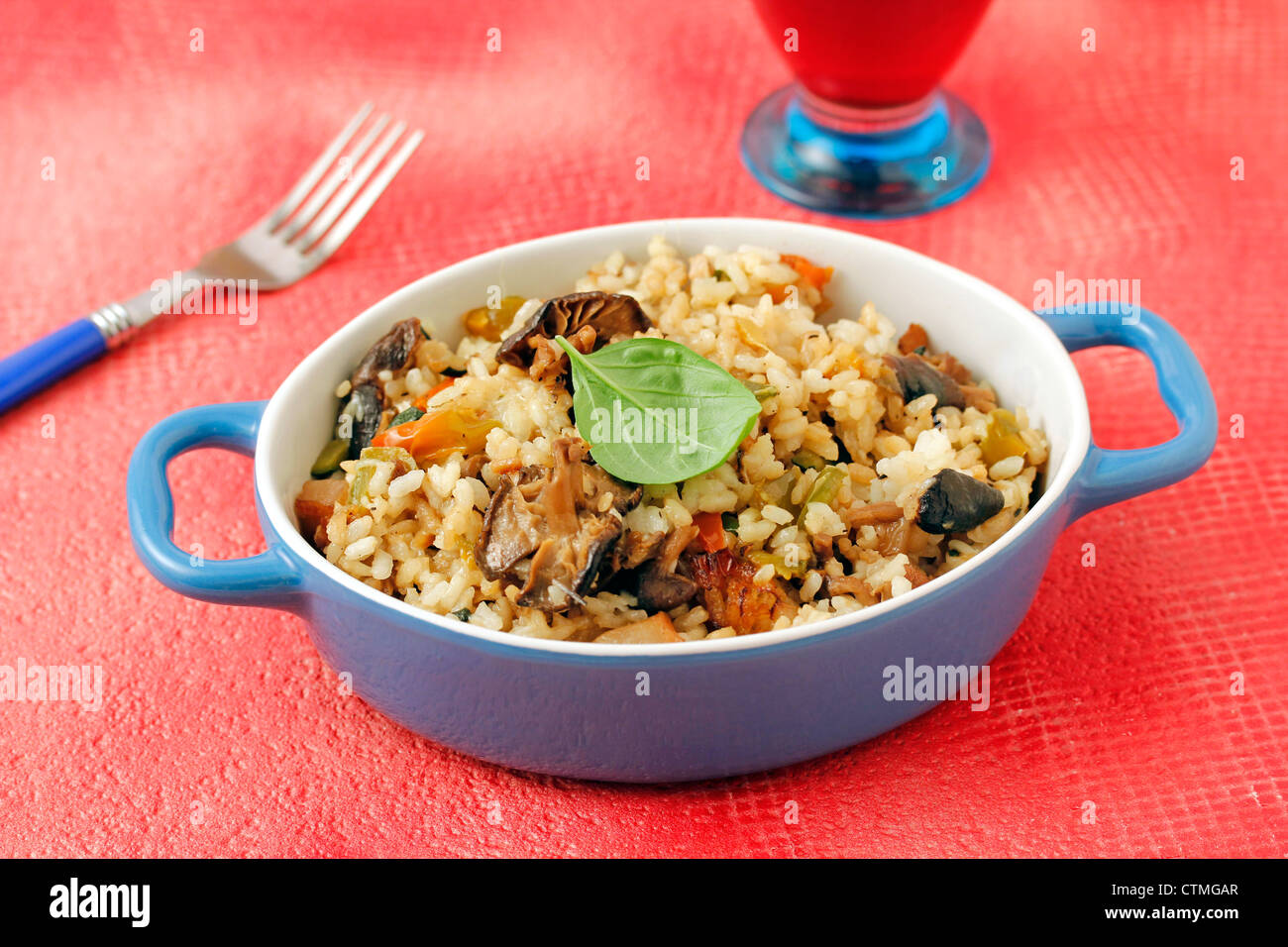 Risotto with mushrooms and basil. Recipe available. Stock Photo