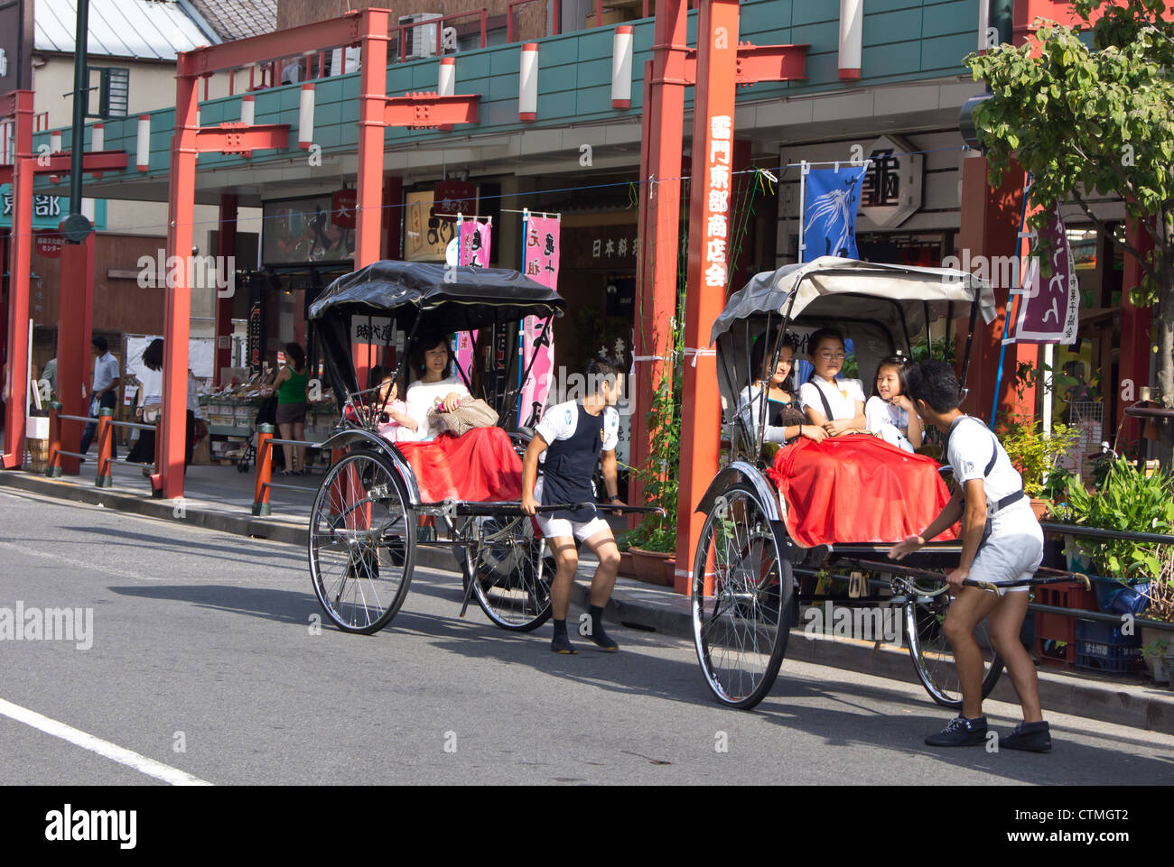 A foot rickshaw in operation for tourists in Tokyo Japan Stock Photo