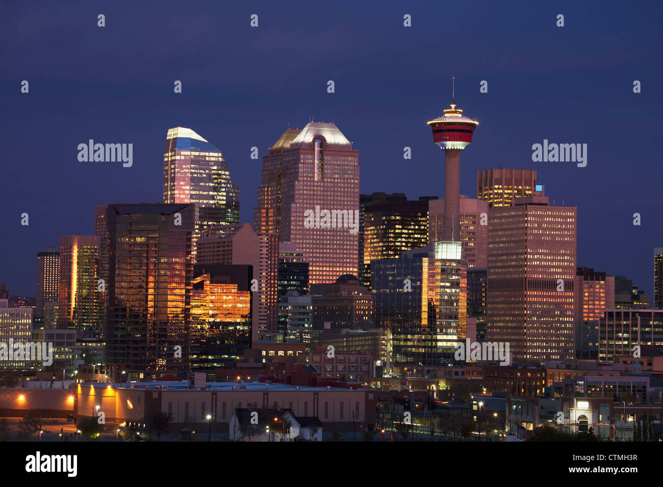 Calgary Skyline At Dawn With City Lights And Deep Blue Sky With
