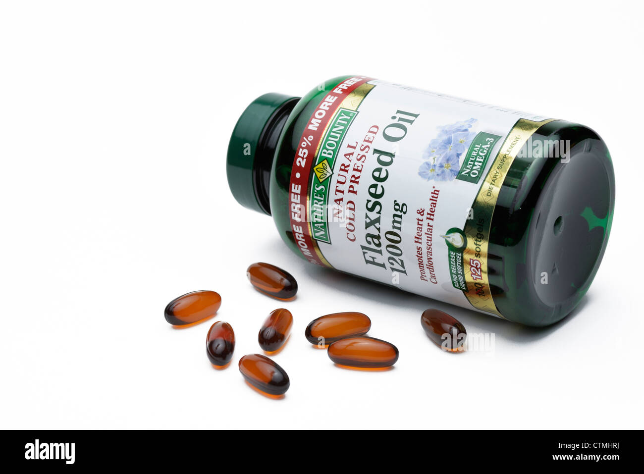 Flaxseed oil pill bottle, a nutritional source of omega-3 and omega-6 fatty acids Stock Photo