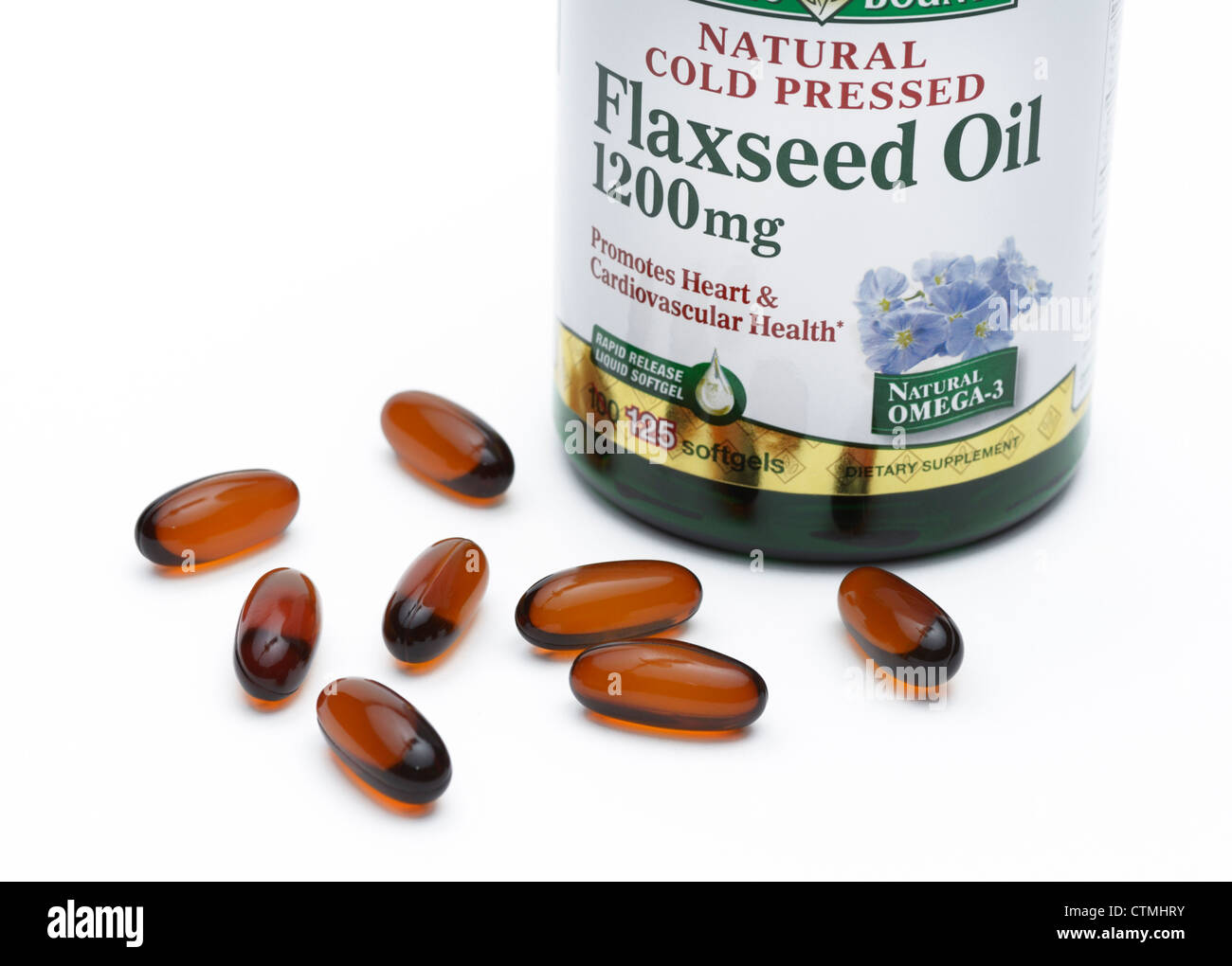 Flaxseed oil pill bottle, a nutritional source of omega-3 and omega-6 fatty acids Stock Photo