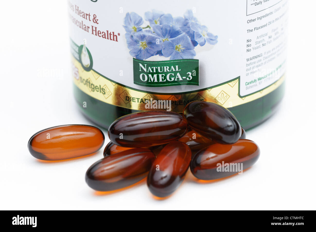 Flaxseed oil pill bottle, a nutritional source of omega-3 and omega-6 fatty acids Stock Photo