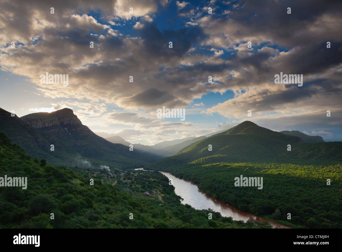 Olifants River flowing into low veldt past township below Abel Erasmus pass, Mpumalanga Province, South Africa Stock Photo