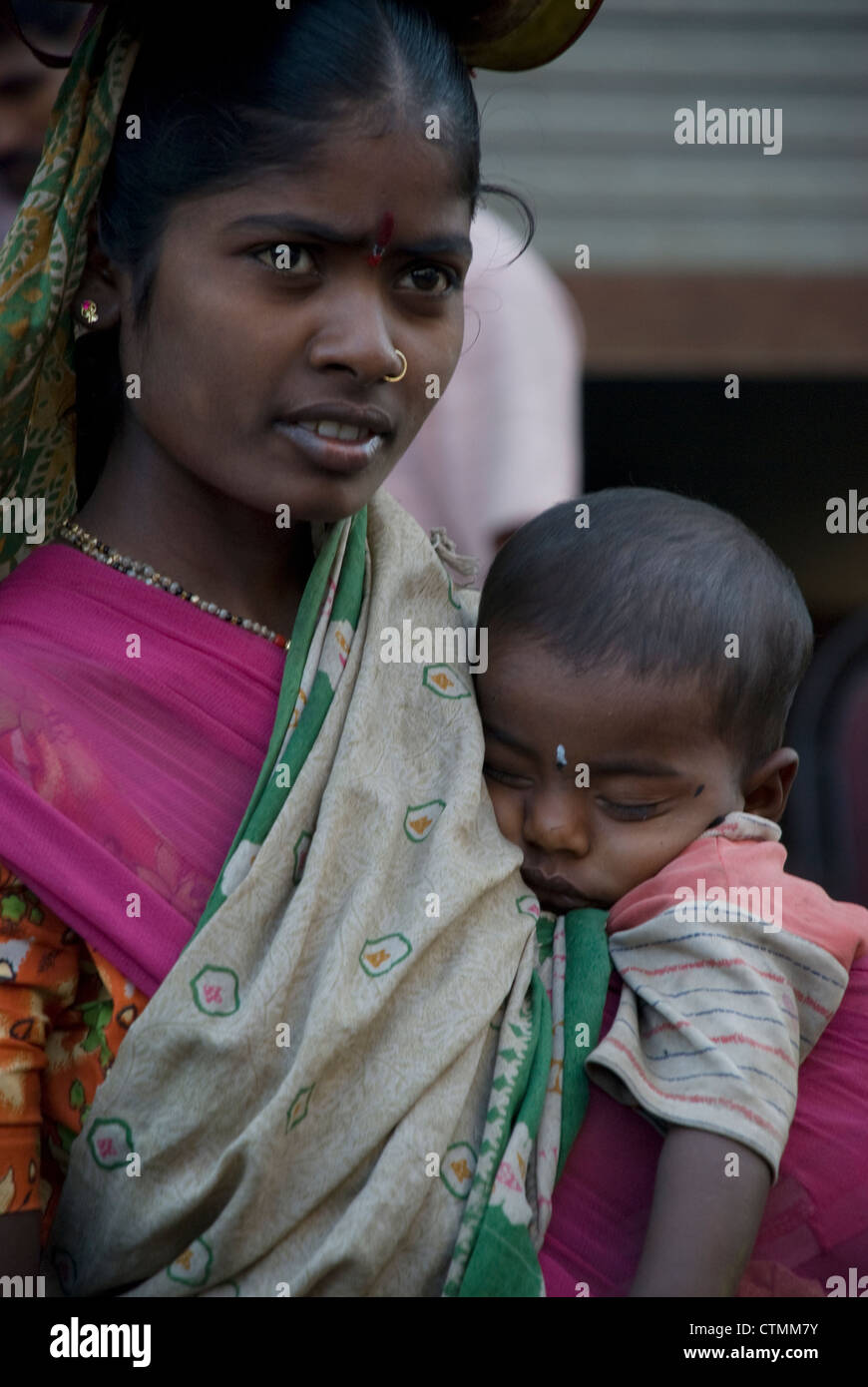 woman her boy in her arms - Mumbai, India Stock Photo -