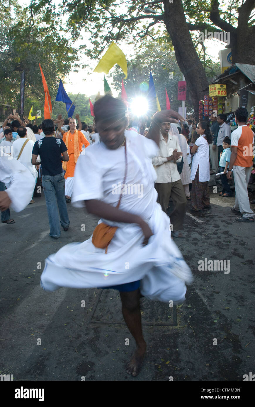 Hare Krishna devotee dancing ecstatically during on of their processions in India Stock Photo