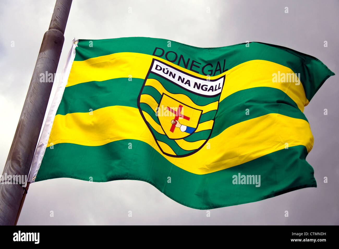 Flag of Donegal or Dun na nGall Irish county in Gaelic language flying from a lampost Stock Photo