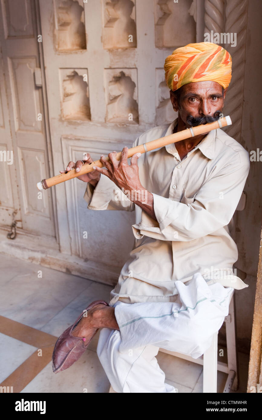 Indian man playing the flute hires stock photography and images Alamy