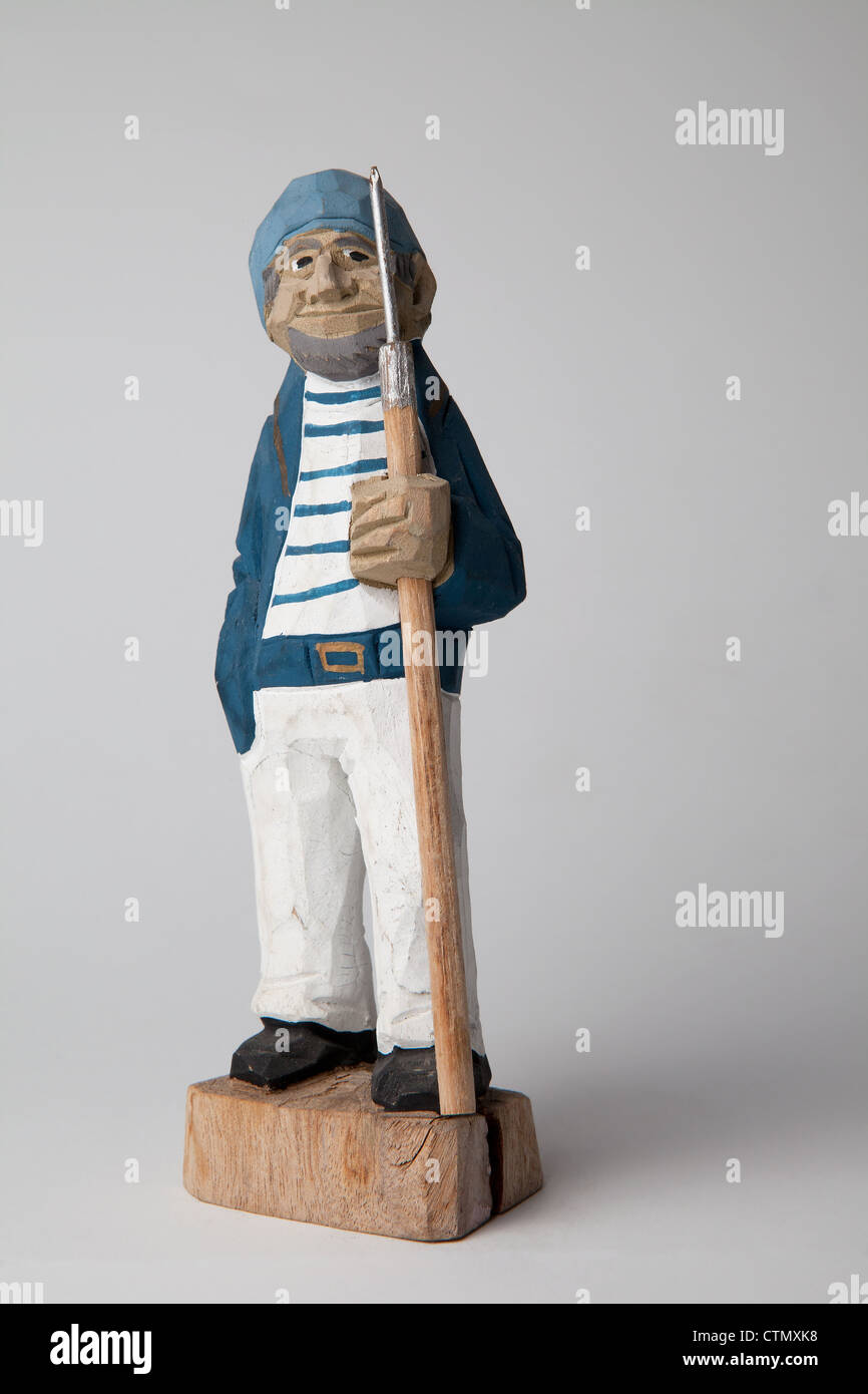 carved wooden sailors vintage kitch collectible sea navy captain sailor on white background fisherman European English models Stock Photo