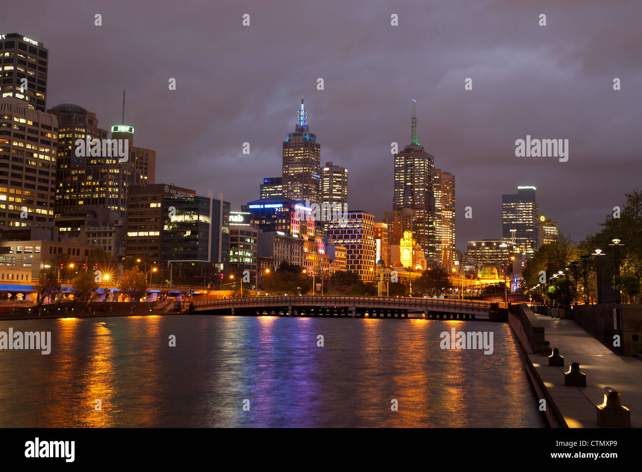 Melbourne Australia Southbank cityscape skyline at night, cit lights, view across the Yarra River showing queenbridge street Stock Photo