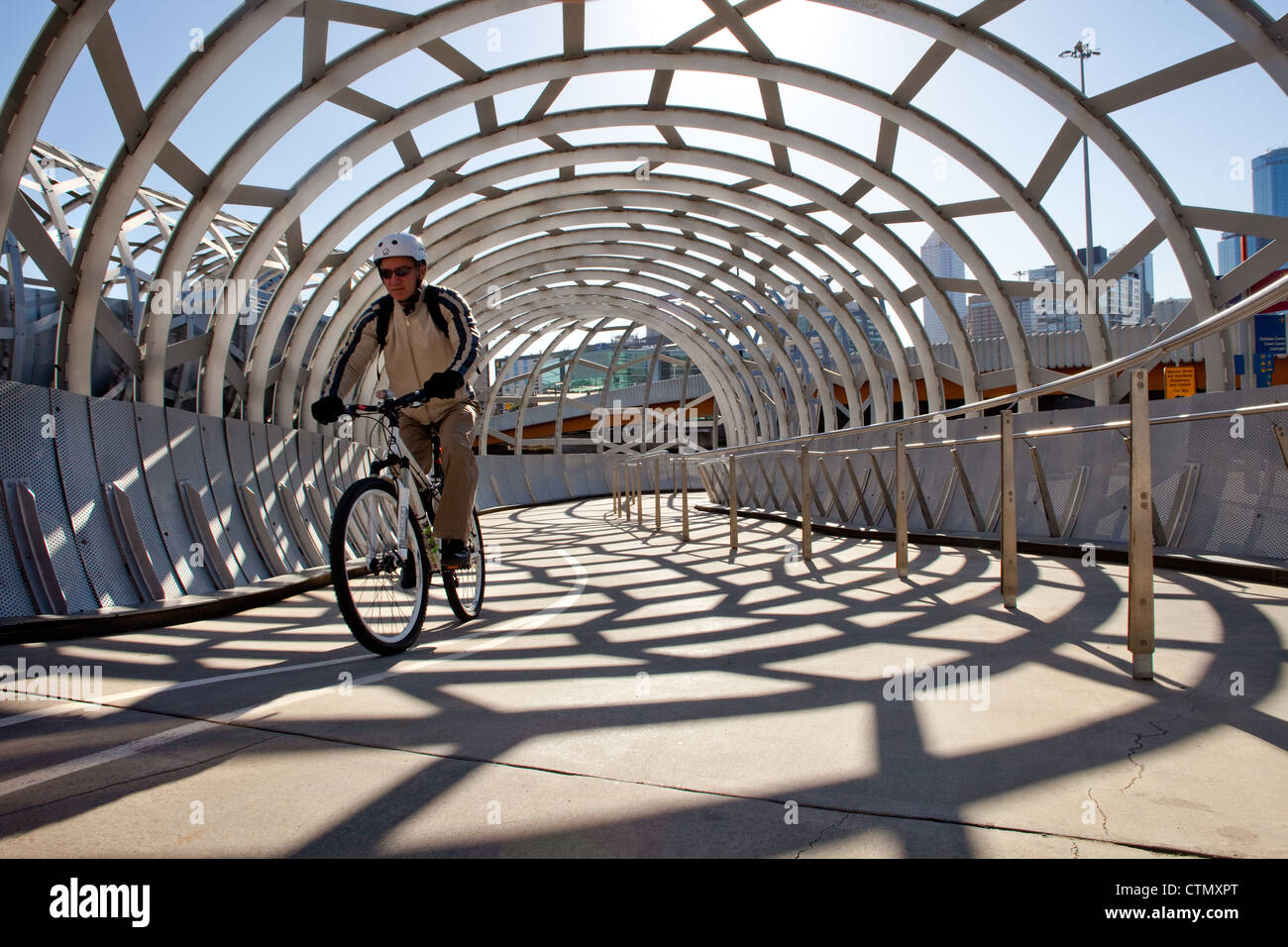 Melbourne webb bridge over yarra river, docklands harbour in Victoria Australia cyclist cycling path ride. with web pattern. Stock Photo