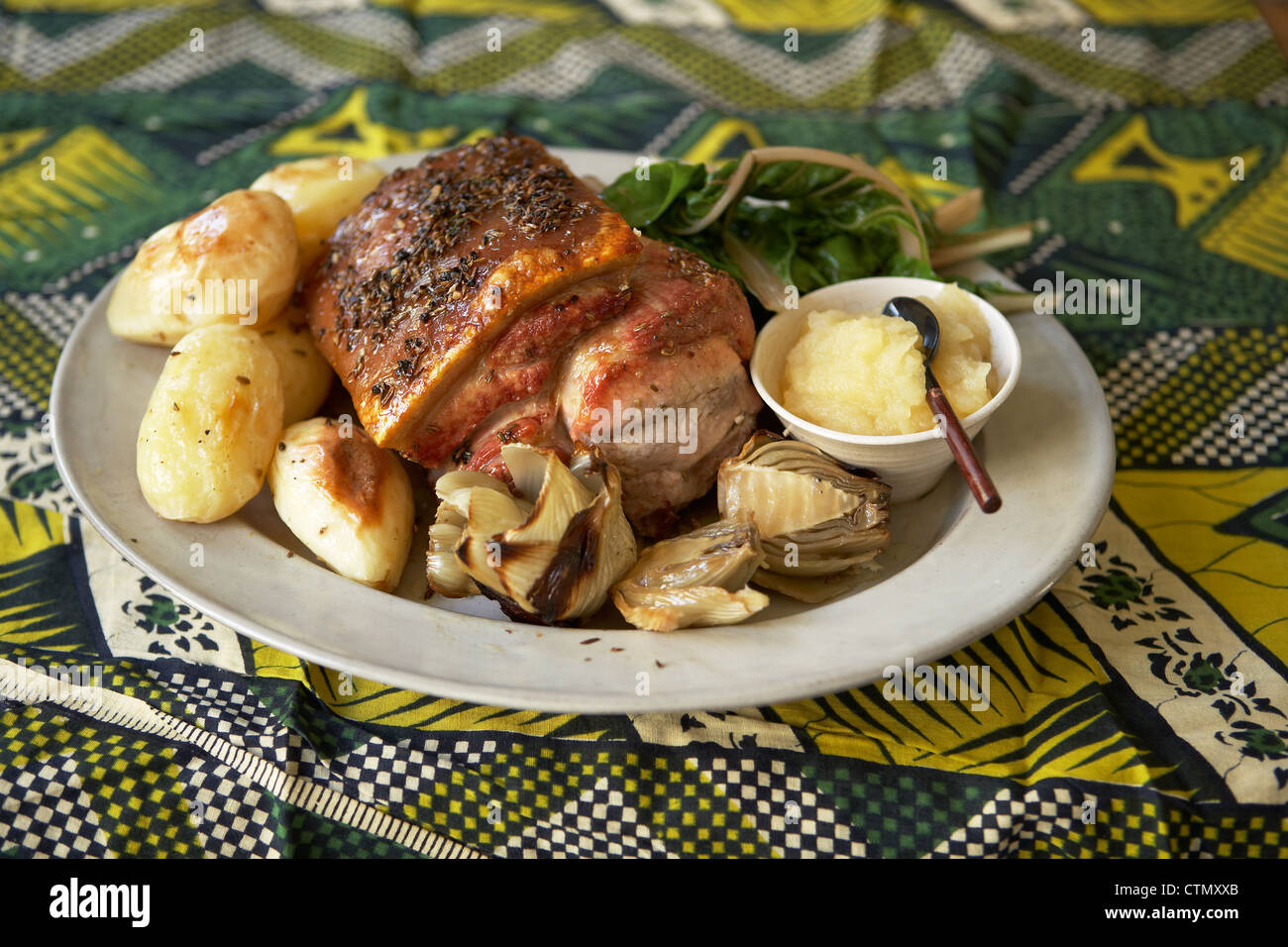 Traditional African cooking. Roast loin of pork with fennel bulbs Stock