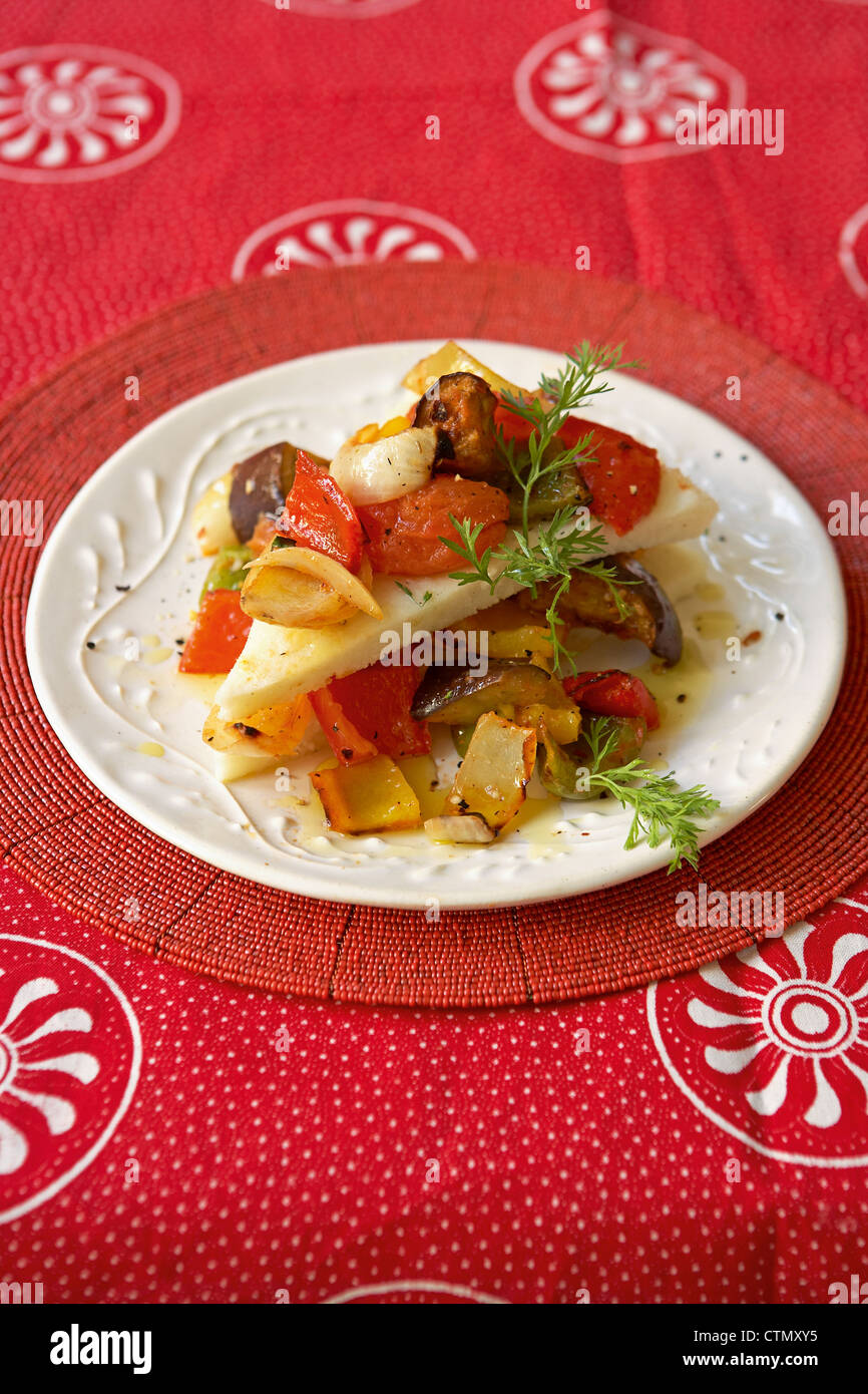 Traditional African cooking. Grilled vegetables with mealiepap stack Stock Photo