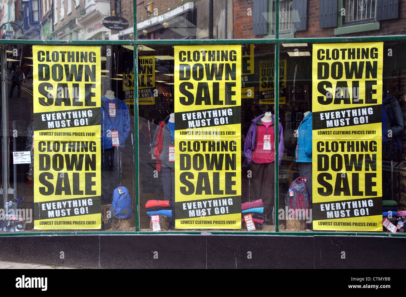 clothing sale signs, shop window, Whitby, North Yorkshire, England, UK