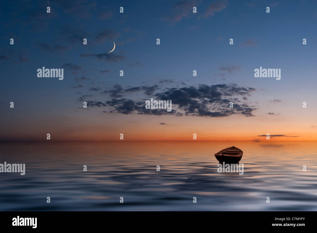 The lonely old boat at the ocean, evenig sky with moon and clouds on background Stock Photo