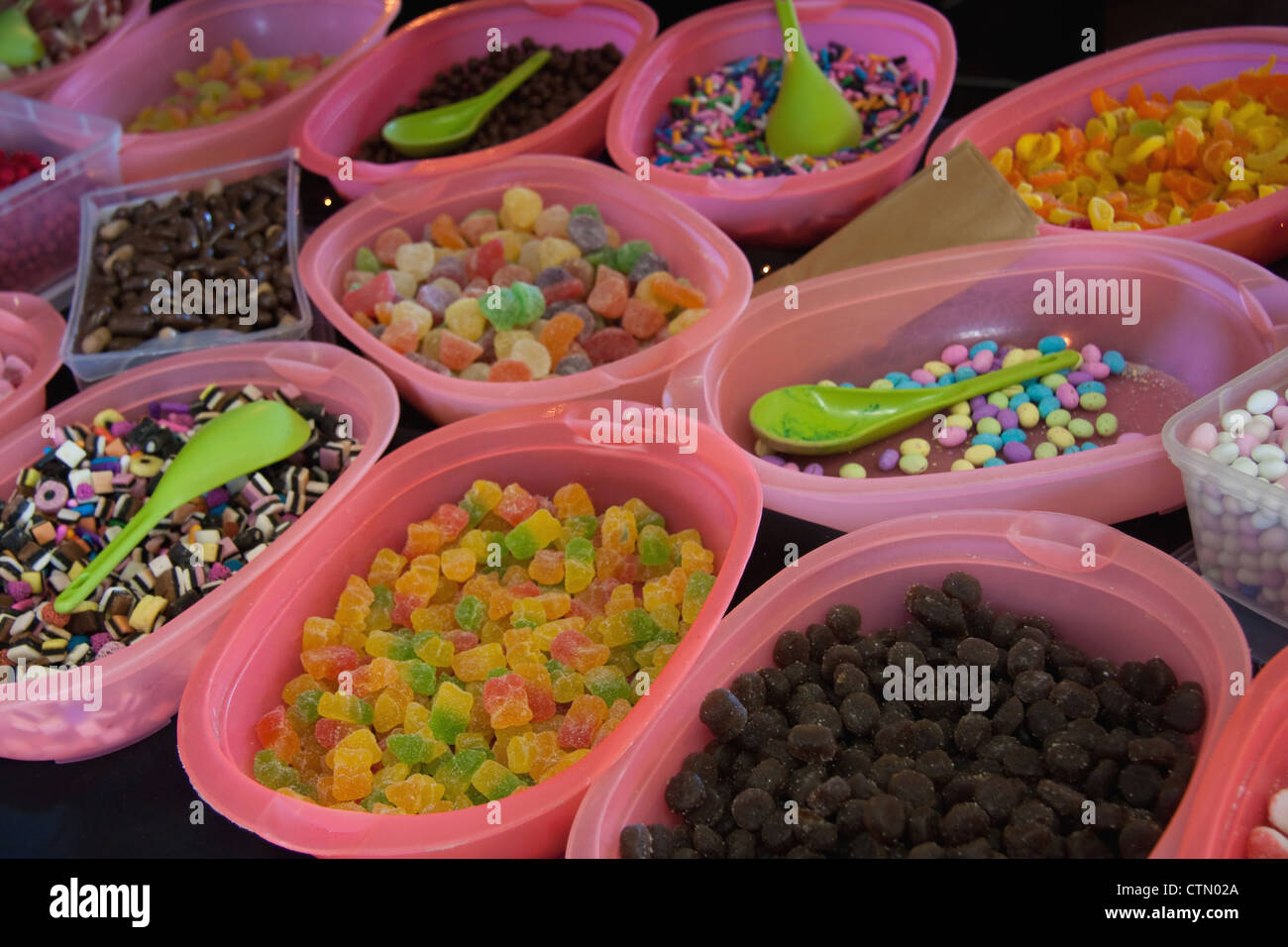 Bowls of multicoloured sweets on display at stall in Mossel Bay, Western Cape, South Africa