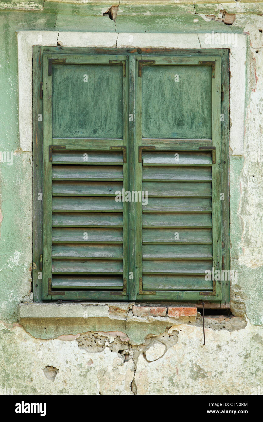 Rustic green window sashes spotted in a village near Sighisoara, Romania Stock Photo