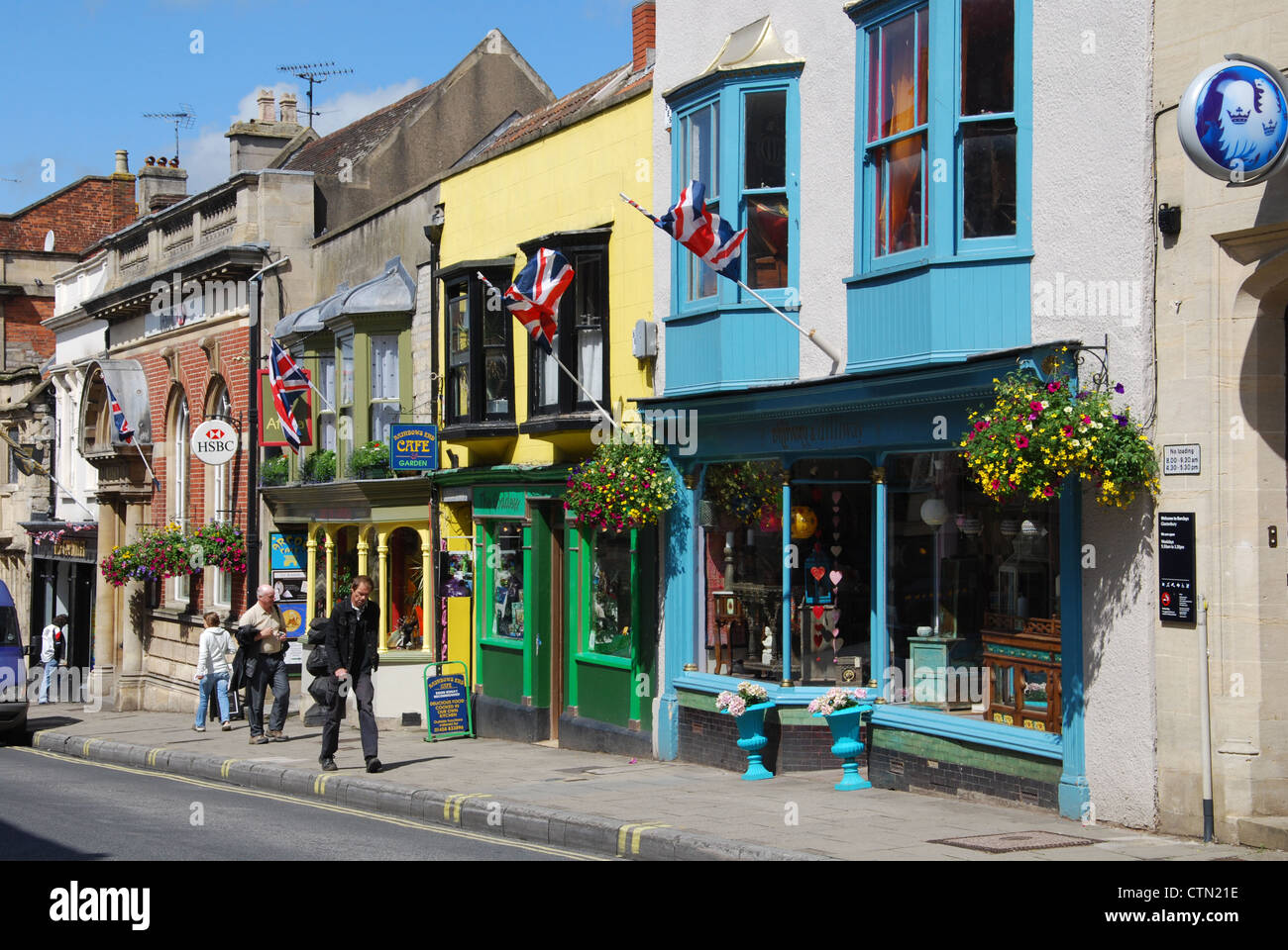 Colourful shops in Glastonbury High Street Somerset England Stock Photo
