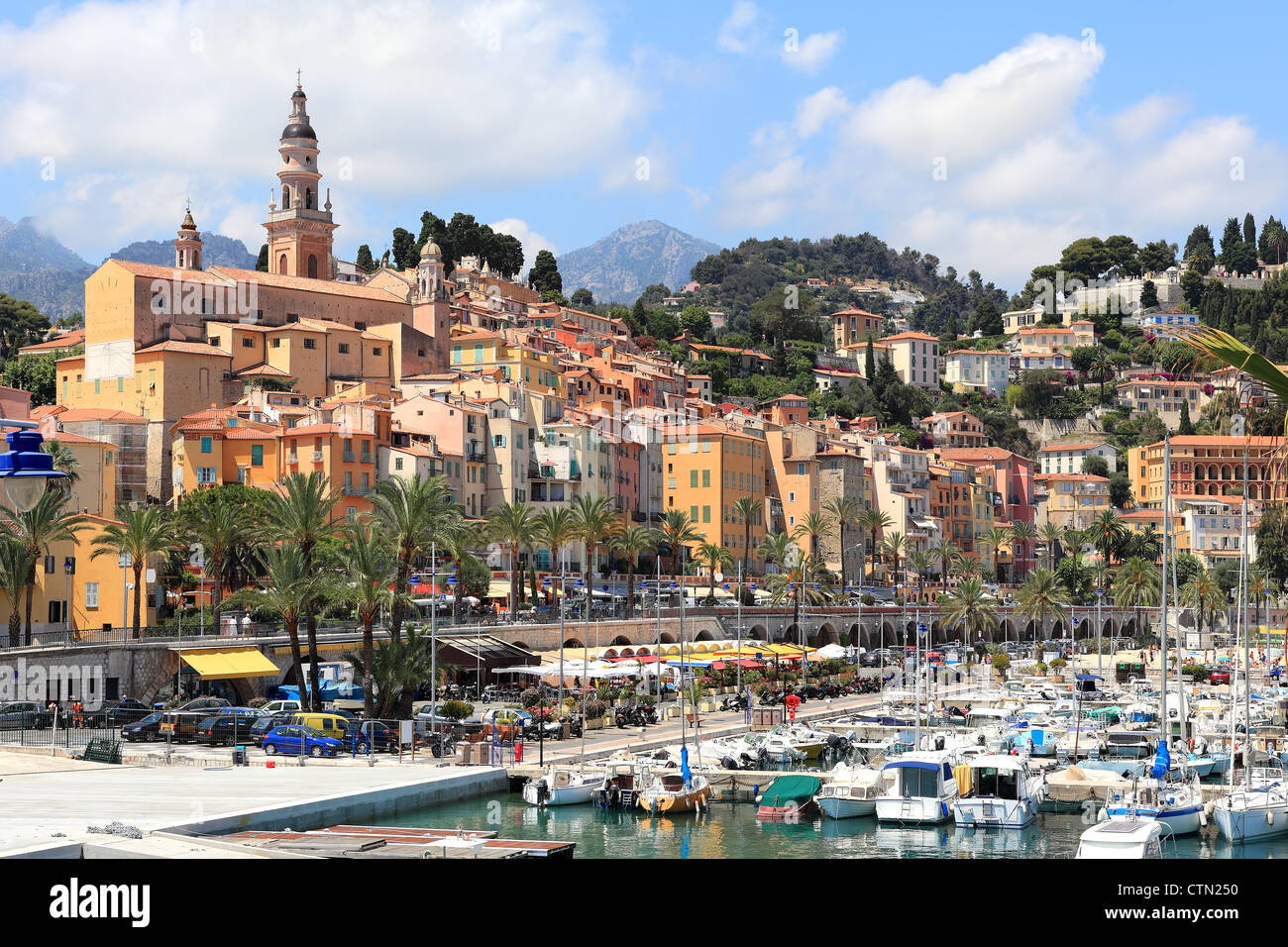 View on old town of Menton over marina with yacht on French Riviera in France. Stock Photo