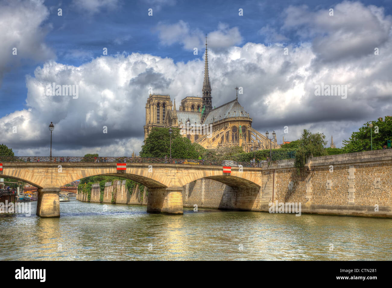 View on Notre Dame Cathedral under beautiful sky with white clouds in Paris, France. Stock Photo