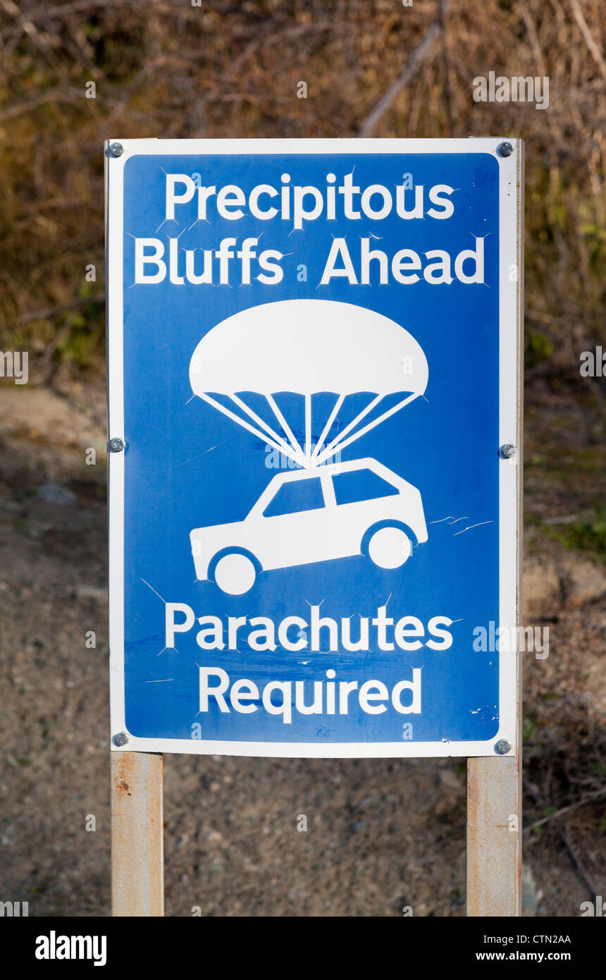 Humourous road sign on precipitous 4WD mountain passes above Queenstown, New Zealand Stock Photo