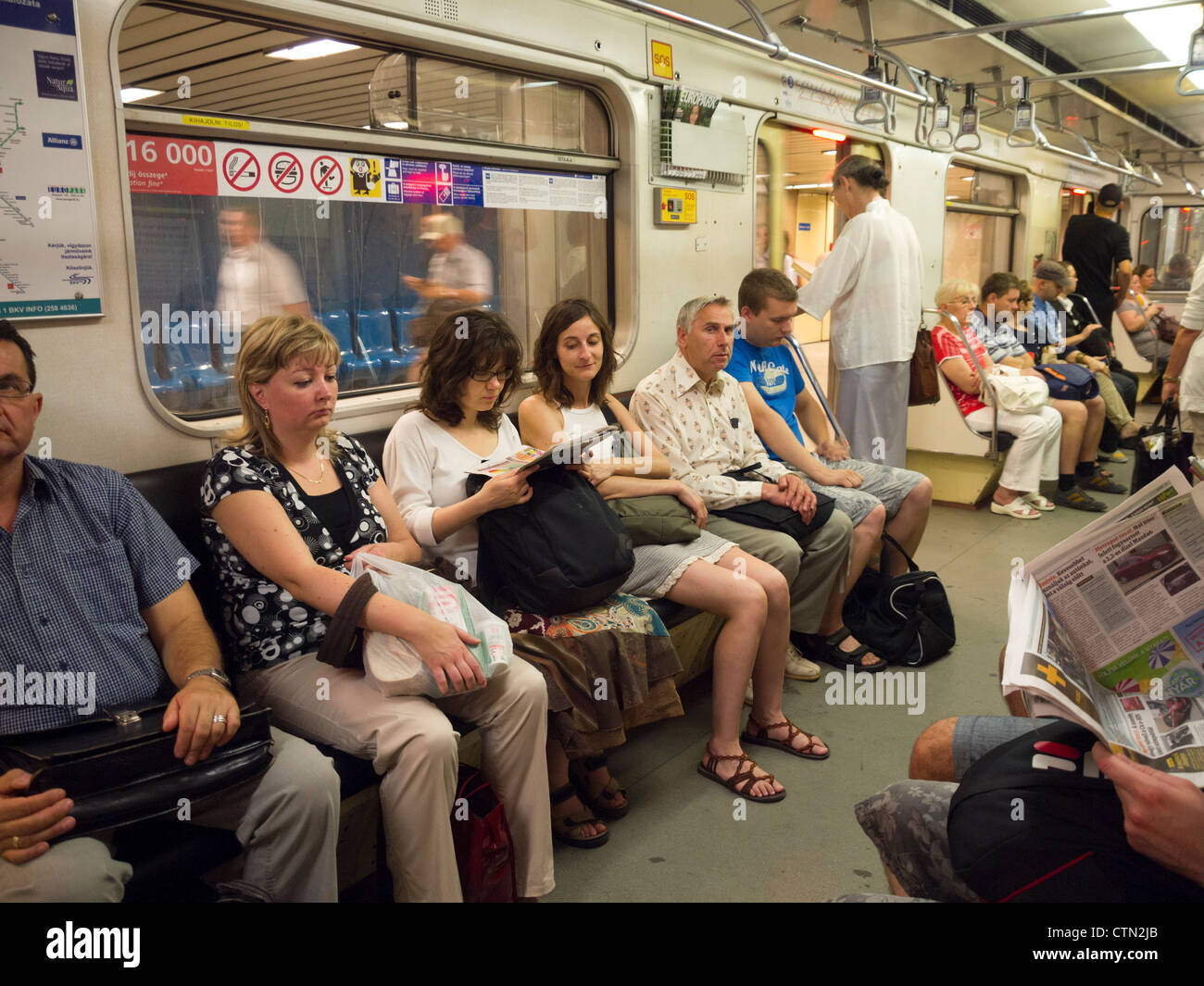 Passengers in an underground tube train, Budapest, Hungary, Eastern Europe Stock Photo