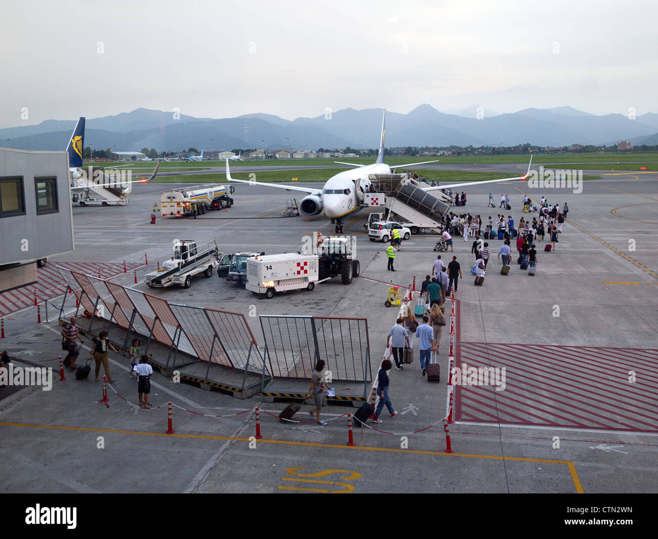 Passengers boarding airplane Stock Photo